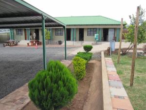 a group of bushes in front of a building at Motse River Lodge R37 Road in Vosburg +11 photos