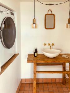 a bathroom with a sink and a mirror at Small Beach House With Sea View At Little Belt in Strib