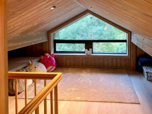 a small room with a bunk bed in a cabin at Renovated Cabin With Views Over Breimsvatnet in Klakegg