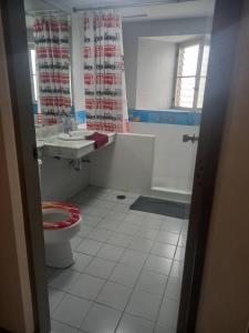 a bathroom with a toilet and a sink and a shower at Great Value Residence in Bangna