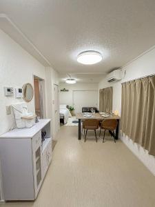 a bathroom with a table and chairs in a room at COMMA House in Yokohama +45 photos