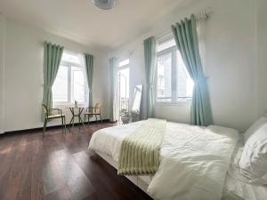 Postel nebo postele na pokoji v ubytování Moon in Mist Homestay + 16 fotografií