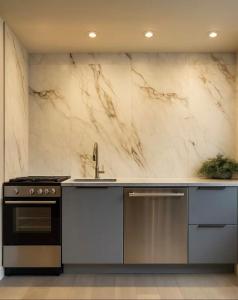 a kitchen with a sink and a stove at 3 KING BedsnFree parking Exactly Where You Belong in Pittsburgh