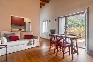 a living room with a couch and a table at Blue Lake Omegna in Omegna