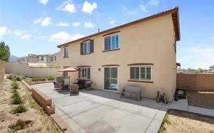 a home with a patio and a house at Rois Yucaipa in Yucaipa