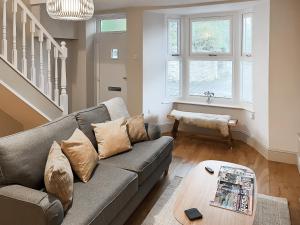 a living room with a couch and a table at Walkers Retreat in Crook