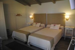 A bed or beds in a room at Villa Hermes