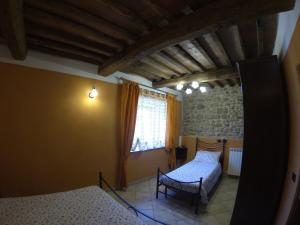 A bed or beds in a room at Agriturismo il Tiglio
