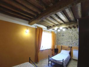 Postel nebo postele na pokoji v ubytování Agriturismo il Tiglio