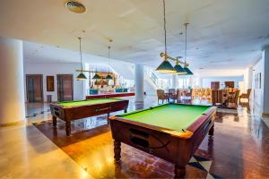 a room with two pool tables and a bar at SBH Costa Calma Palace Thalasso & Spa in Costa Calma