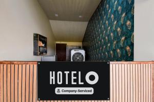 a hotel sign in front of a hotel room at Hotel O Rajaram Singh Blessing Garden And Hotel in Prayagraj
