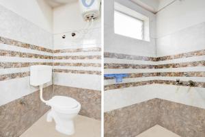 カルヌールにあるHotel O Kurnool Bus Stand Formerly RR Residencyのレンガの壁とトイレのあるバスルーム