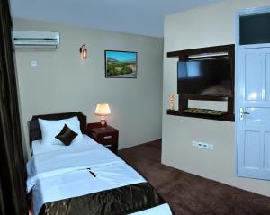 Postel nebo postele na pokoji v ubytování Kabul Guest House