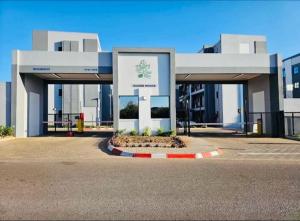 a building with a sign in front of it at EchoPheme Suites in Gaborone