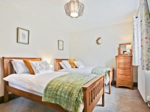 En eller flere senge i et værelse på Hillberry Cottage