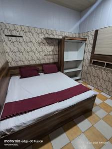 a bedroom with a large bed in a room at Annu Bhai Sewa Sadan in Mathura