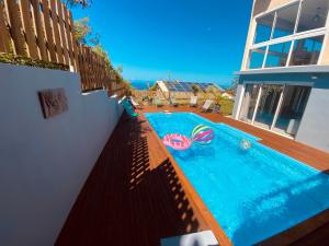 a swimming pool in the backyard of a house at La Villa Lyla in Étang-Salé