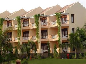 an exterior view of a building with plants at Can Gio Resort in Can Gio