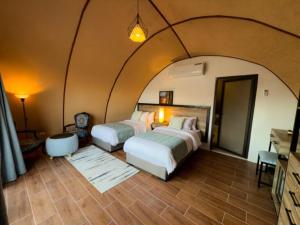 Ένα ή περισσότερα κρεβάτια σε δωμάτιο στο Luxury Spiral Camp