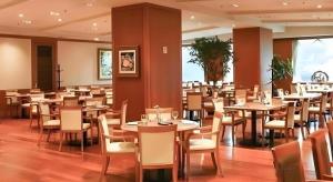 a dining room filled with tables and chairs at Jeju Sejong Hotel in Jeju