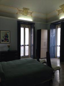 Postel nebo postele na pokoji v ubytování B&B DIMORA DUCALE gia Cavour