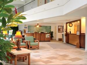 a lobby of a hospital with chairs and a table at Wyndham Royal Sea Cliff Resort in Kailua-Kona +134 photos