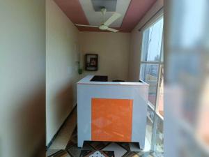 a room with a counter and a large window at Hotel O Shrihaan Residency in Rāmachandrapuram