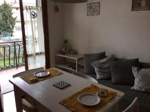 a living room with a table and a couch at Intorno Firenze B&B in San Piero a Sieve +20 photos