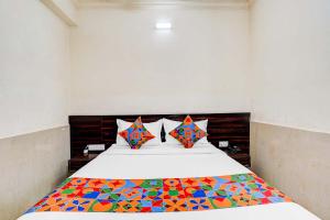 En eller flere senge i et værelse på Via NAR Comforts - Majestic