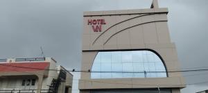 a building with a hotel wa sign on it at Hotel VN in Bhavnagar