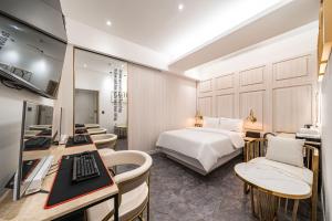 a hotel room with a bed and a desk at HotelInsta Main Branch in Pŏlt'ŏ