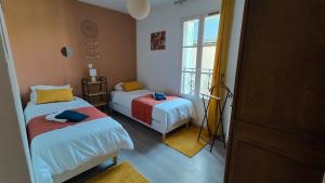 Postel nebo postele na pokoji v ubytování Gite Centre Montbazon