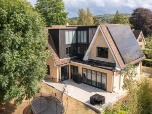 an aerial view of a house with a solar roof at Pass the Keys Stunning home with private parking in Bath in Bath