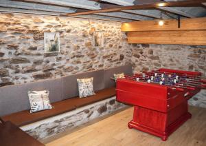 a ping pong table in the middle of a room at Casa Macia Roni in Roní