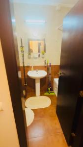 a bathroom with a white sink and a mirror at Stenata Huge Ski To Door Apartments in Pamporovo