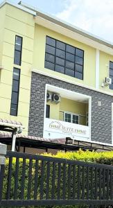 a building with a sign that reads rent a white house at Home Suite Home Singkawang in Singkawang