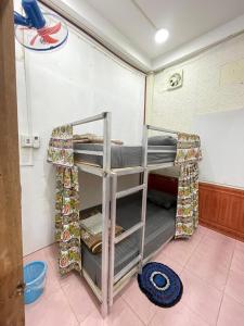 a group of bunk beds in a room at Catty tourist house in Thakhek