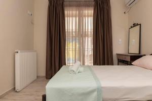 Postel nebo postele na pokoji v ubytování Studios for rent Hermanos + 22 fotografií