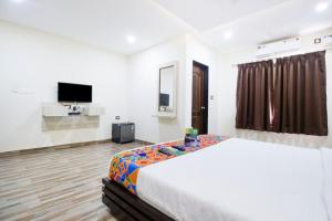 Ένα ή περισσότερα κρεβάτια σε δωμάτιο στο FabHotel The Sky