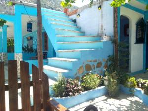 a blue house with stairs in front of it at panorama view in Chefchaouen +10 photos