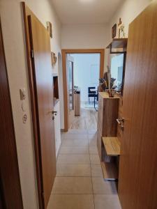 a hallway with a door leading to a room at Alpenglück Apartment in Bach