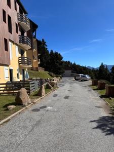 an empty street in front of a building at Magnifique studio à 250 mètres des pistes avec tout inclus in Bolquere Pyrenees 2000
