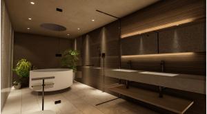 a bathroom with two sinks and a bath tub at 久留里山荘 in Kimitsu