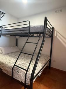 a couple of bunk beds in a room at ESTUDIO LUNA in Sierra Nevada