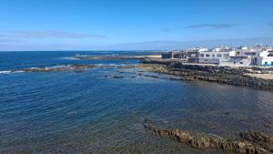 an aerial view of a beach with white buildings at Casa Cactus in Cotillo +5 photos