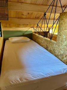 Voodi või voodid majutusasutuse Cosy Lodgy toas