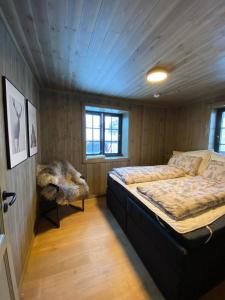 a bedroom with a large bed in a room at Hovden Alpin Lodge Appartement in Bykle