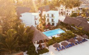 an aerial view of a resort with a swimming pool at La Perla Beach Resort, Zanzibar - Your Beachfront Private Haven in Pwani Mchangani +28 photos
