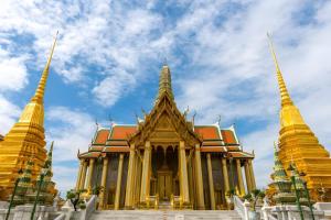 a temple in bangkok with a cloudy sky in the background at GO INN Khaosan BKK - โกอินน์ ข้าวสาร in Bang Bua Thong Railway Station