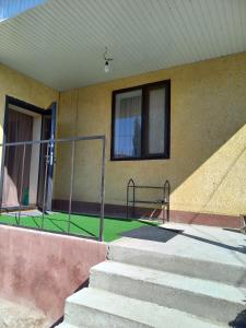 a building with stairs and a window at Asman Guest House 